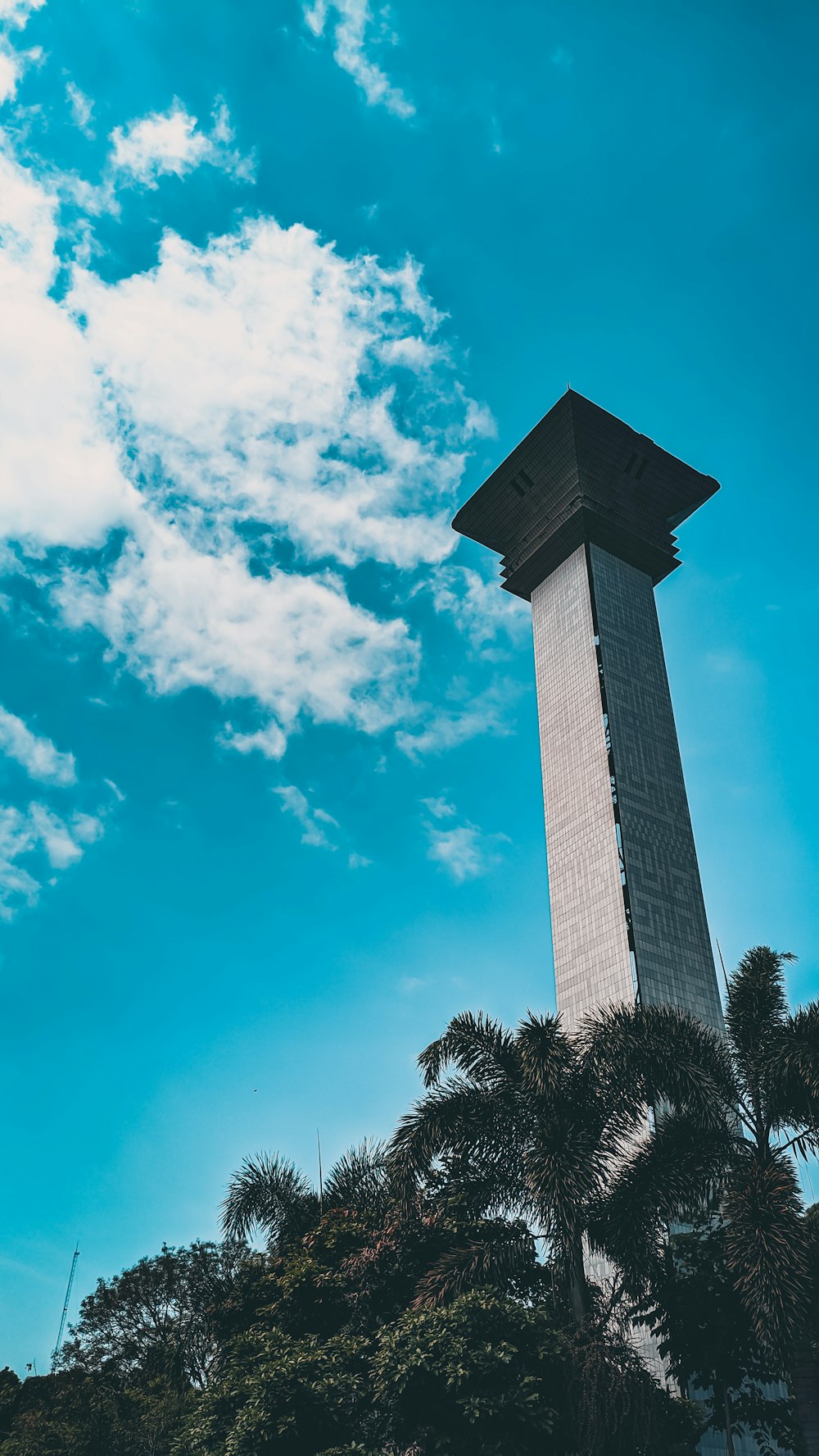 a tall tower with a clock on top of it