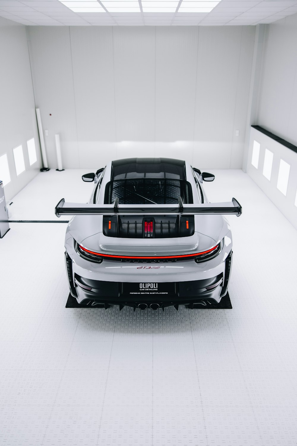 a white sports car parked in a garage