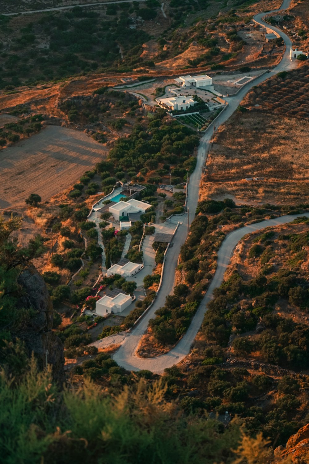 an aerial view of a home surrounded by trees