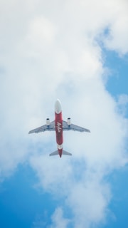 A vibrant image of an airplane flying over a scenic landscape.