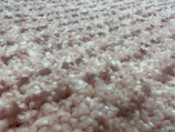 Cut pile velour carpet tiles showcasing soft texture in a hotel conference room.