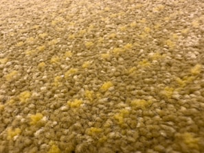Close-up of soft, patterned carpet flooring in a cozy Qatar living room.