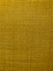 A close-up view of a textured fabric surface with a tight and even weave. The fabric appears to be made of thick threads, tightly interwoven in a grid pattern.