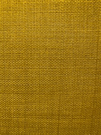 A close-up view of a textured fabric surface with a tight and even weave. The fabric appears to be made of thick threads, tightly interwoven in a grid pattern.