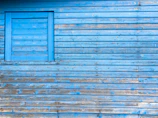 Close-up of a freshly painted blue and white exterior wall on a house in Nîmes.