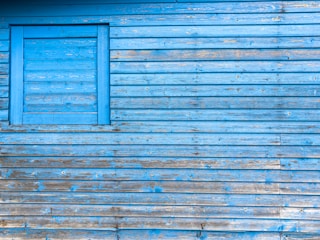 Finished interior wall with fresh, vibrant blue paint