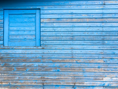 Finished interior wall with fresh, vibrant blue paint