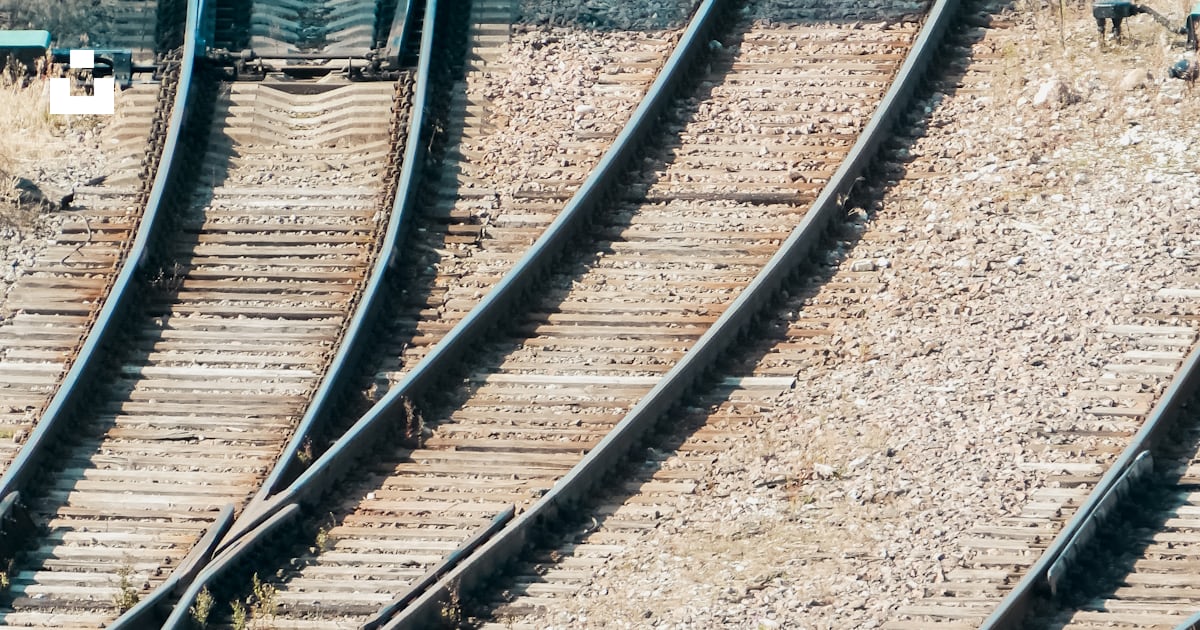 A train track with multiple train tracks running parallel to each other ...
