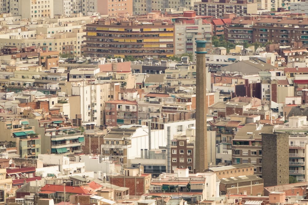 a city with lots of tall buildings and a clock tower