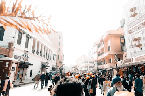 A vibrant street scene in Lahore with colorful markets and traditional architecture under a bright sky.