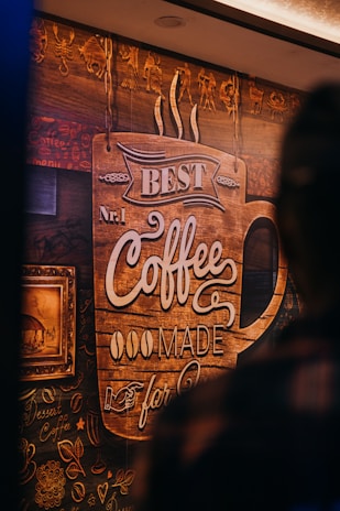 Artistic paintings adorning the walls of the coffee shop.