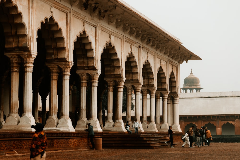 a group of people standing in front of a building