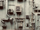 a large industrial building with a lot of pipes