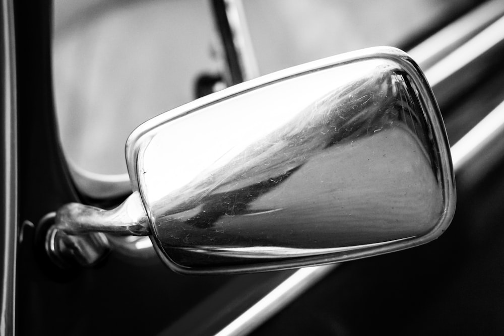 a close up of a mirror on a car