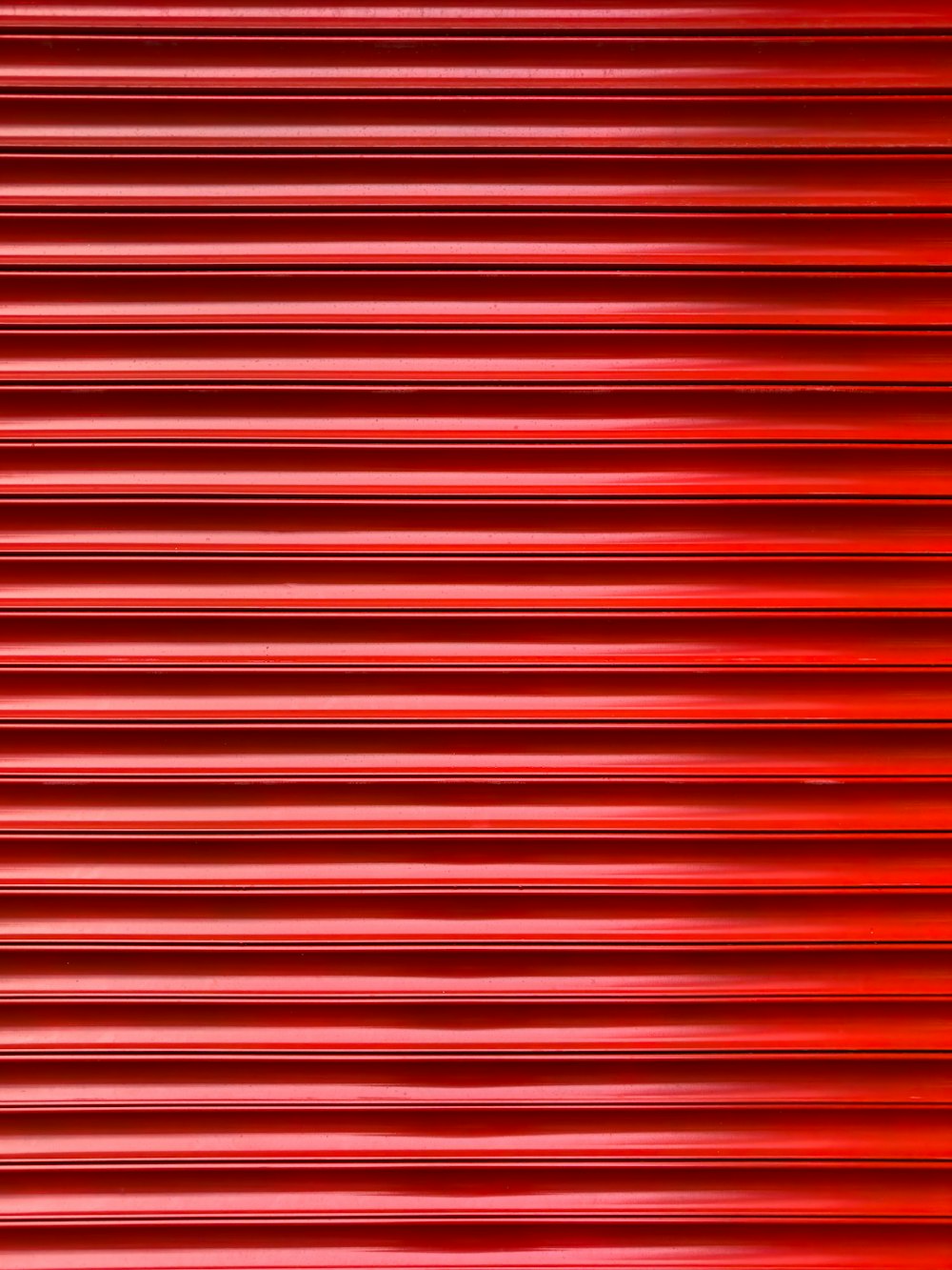 a close up of a red metal surface