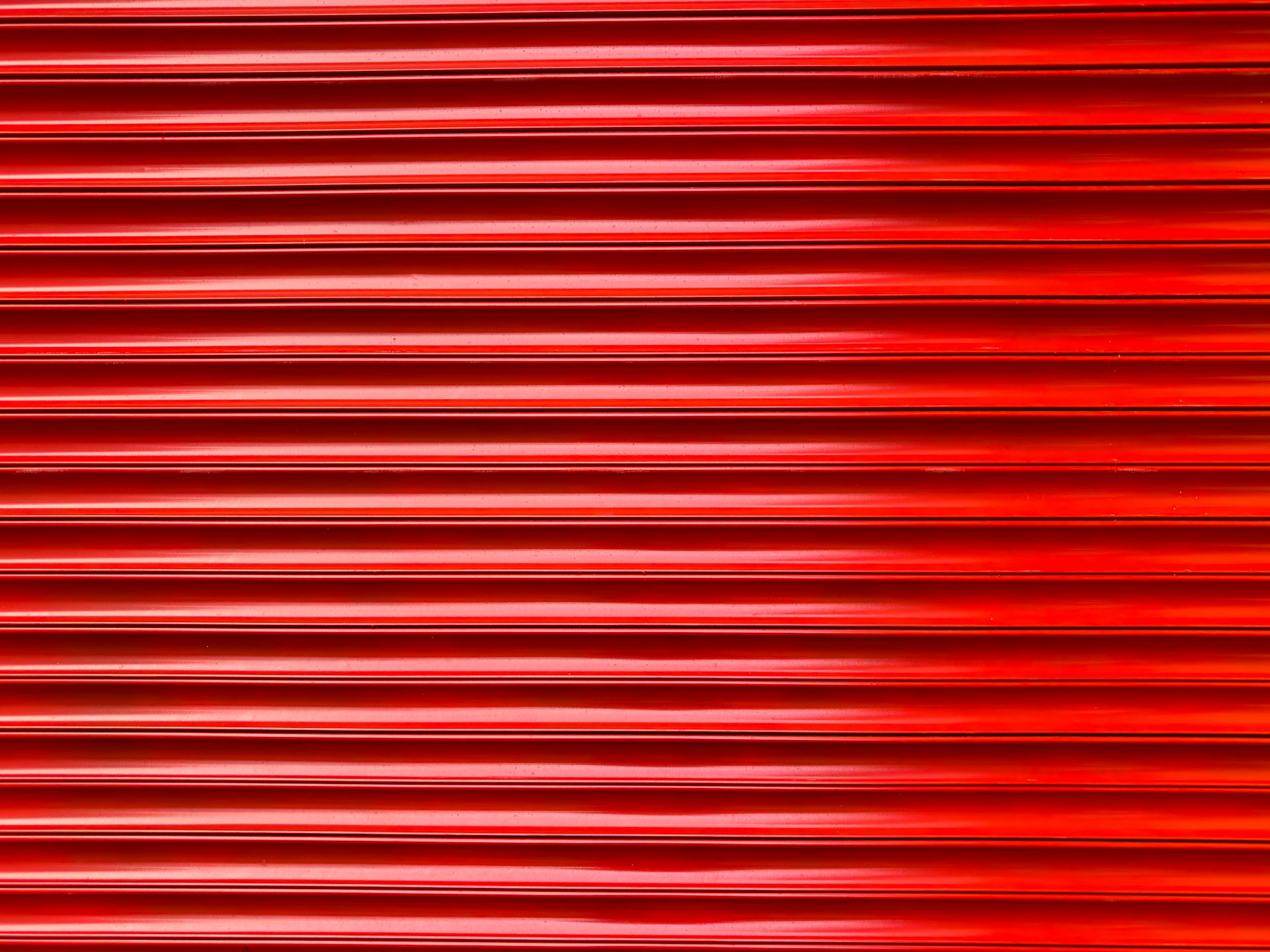 a close up of a red metal surface