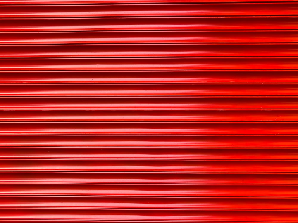 a close up of a red metal surface