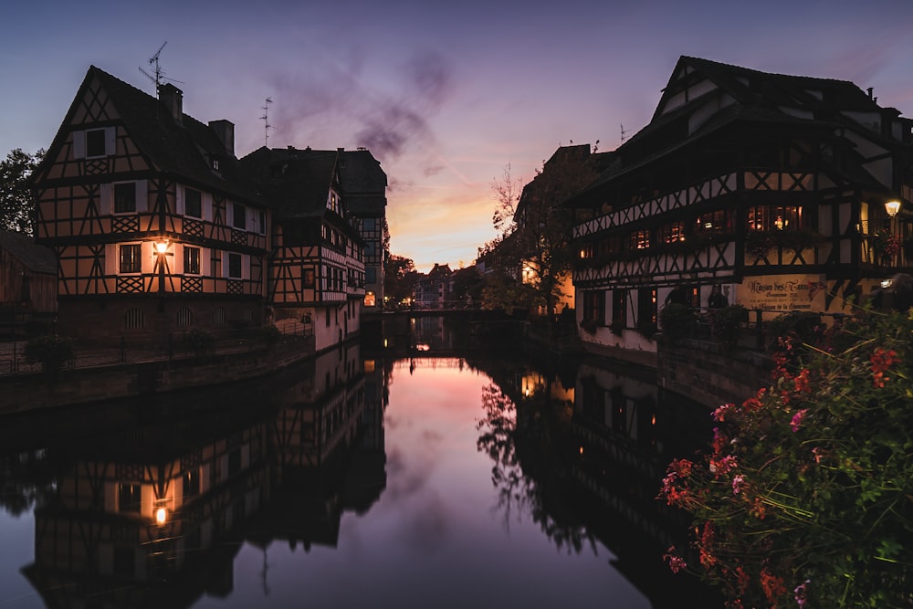 a river running through a city next to tall buildings