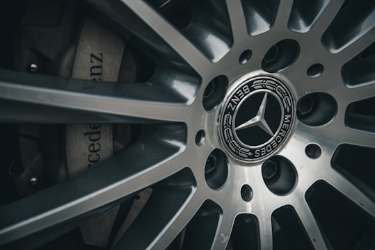 a close up of a mercedes wheel on a car