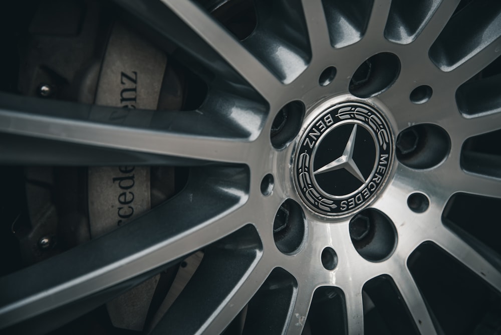 a close up of a mercedes wheel on a car