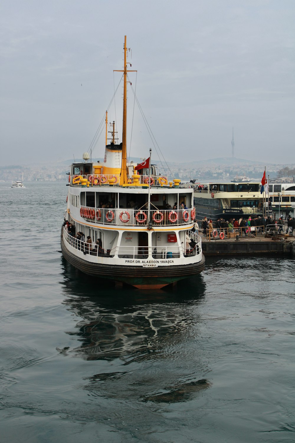 a large boat floating on top of a body of water