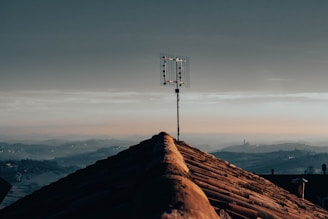 a cell phone tower on top of a roof
