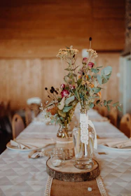A beautifully arranged budget-friendly wedding table setting with rustic Italian decor.