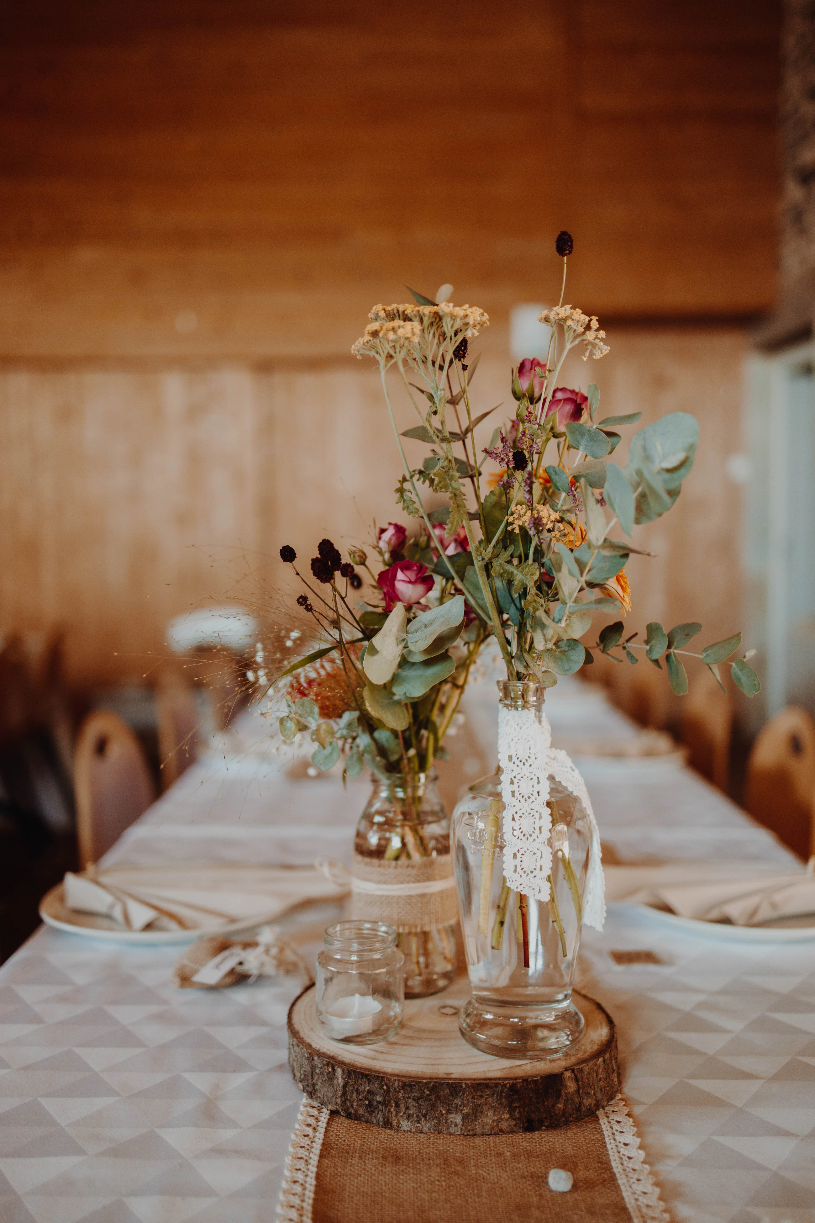 Floral arrangements on a decorated reception table