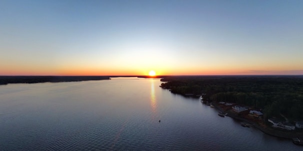 Sunset view from the hotel balcony overlooking the serene river nearby.