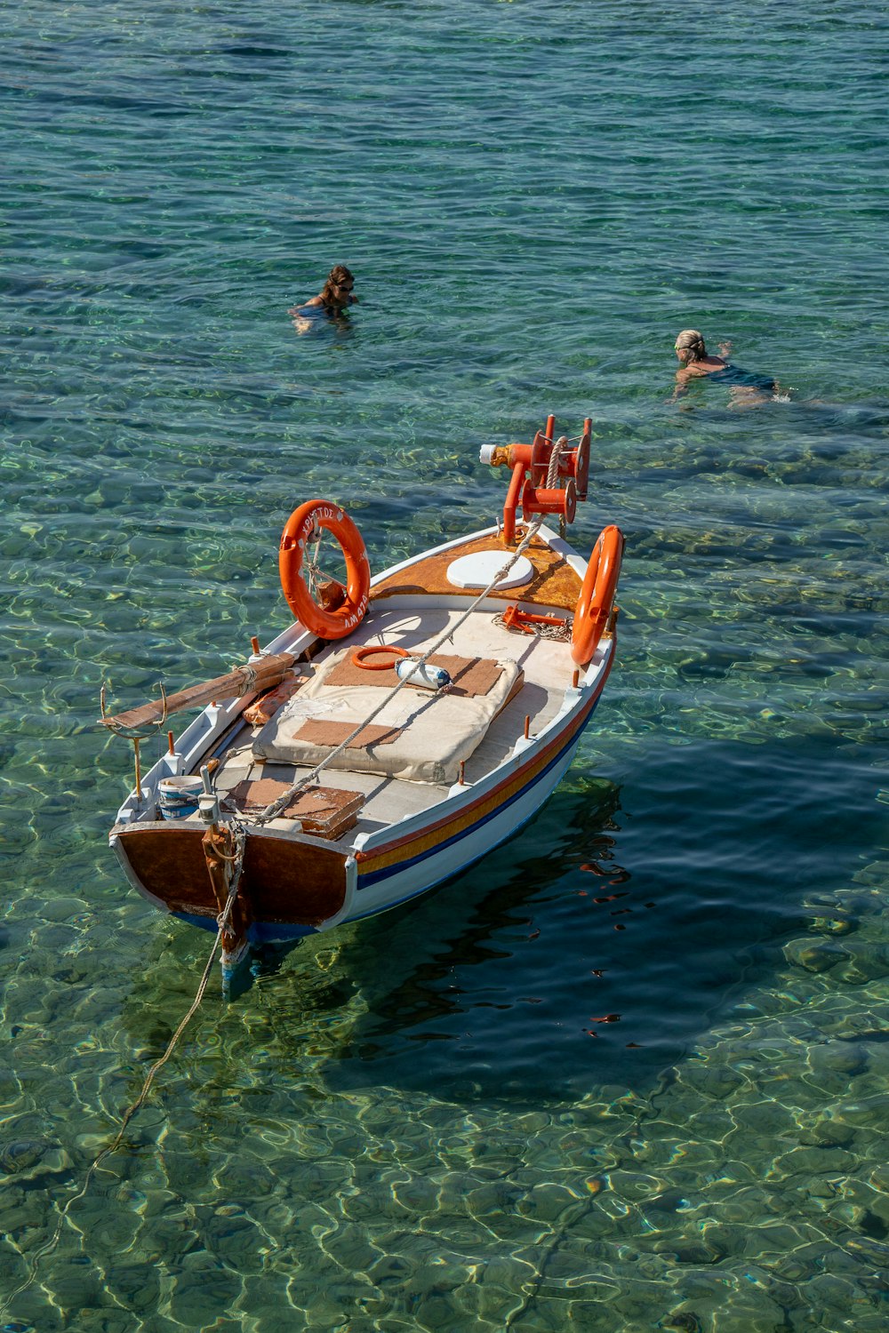 a small boat floating on top of a body of water