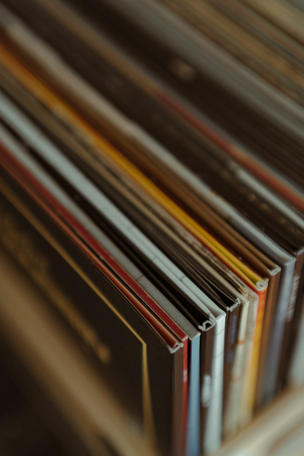 a stack of records sitting on top of a table
