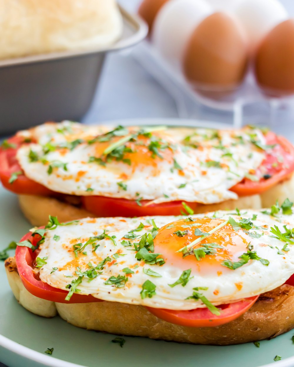 a plate of food with eggs and tomatoes on it