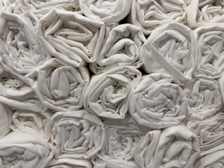 Freshly laundered towels stacked neatly.