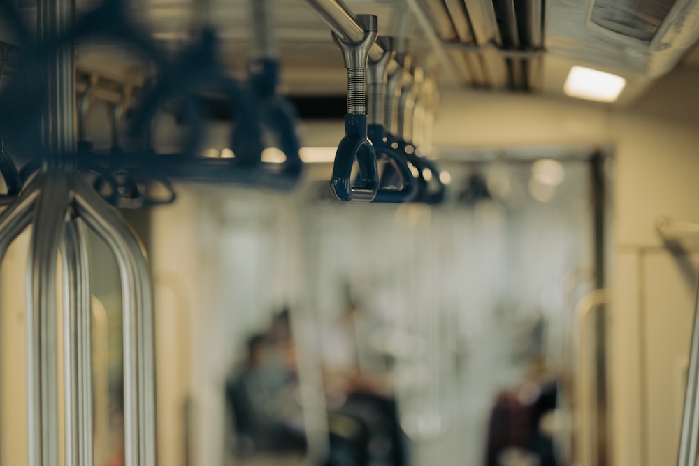 the inside of a subway car with people on it