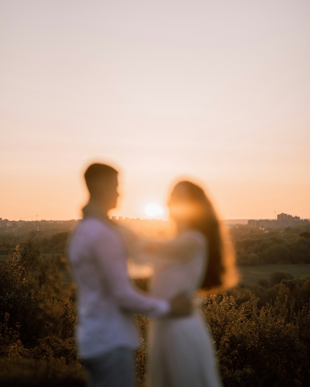 a man and a woman standing next to each other