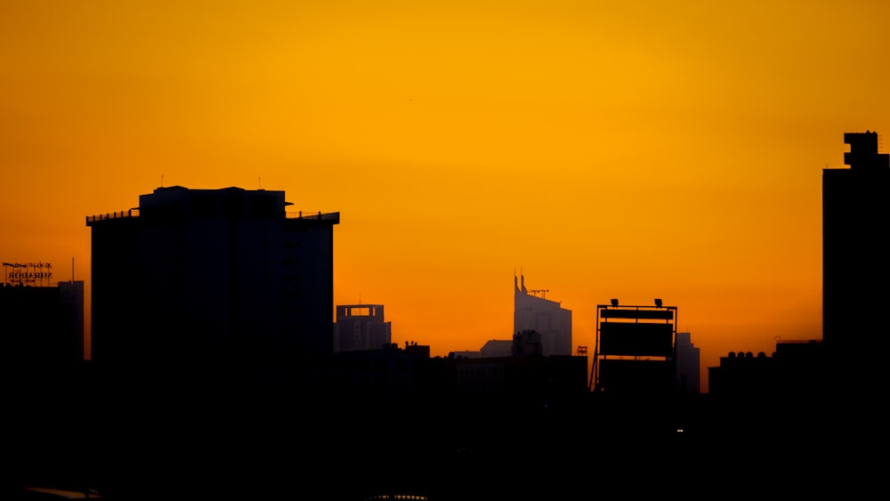 a view of a city skyline at sunset