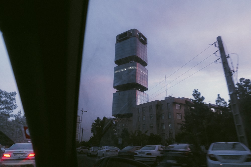 a very tall building sitting on the side of a road