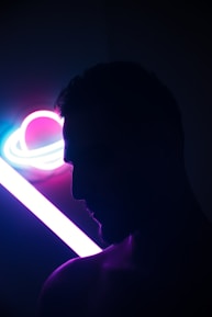 Close-up of a digital persona avatar with neon accents against a black background.