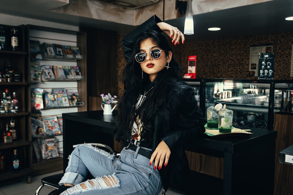 a woman sitting on a chair in a store