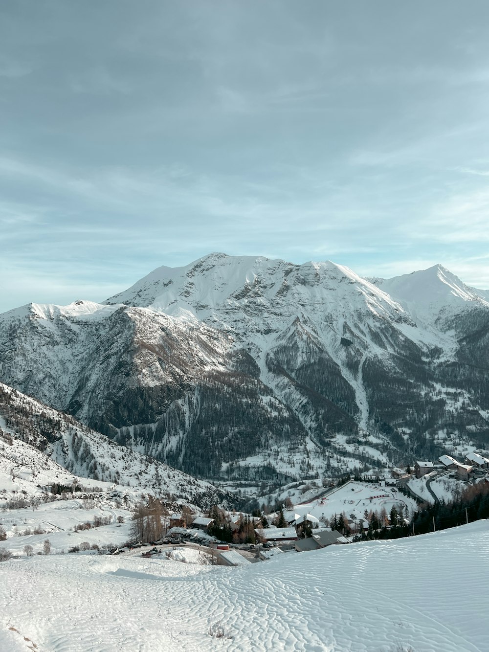 a snow covered mountain with a sky background