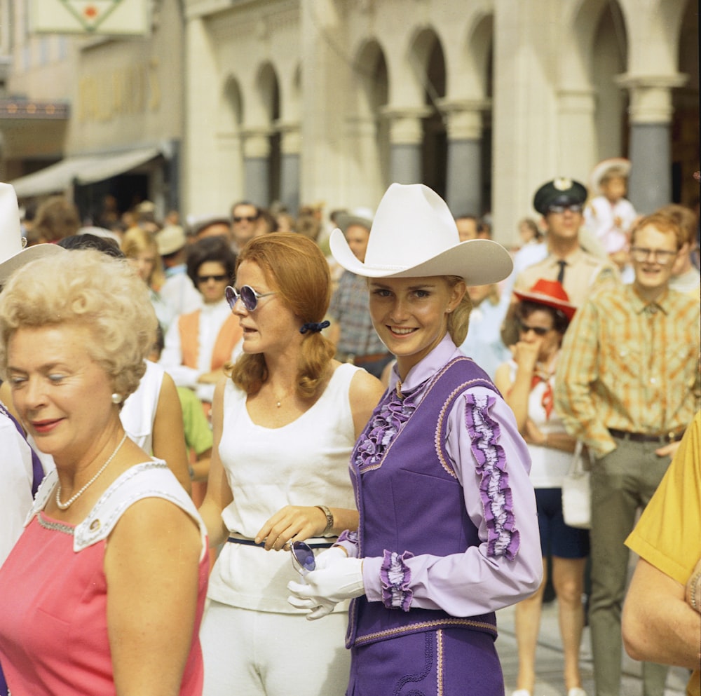 a group of people that are standing in the street