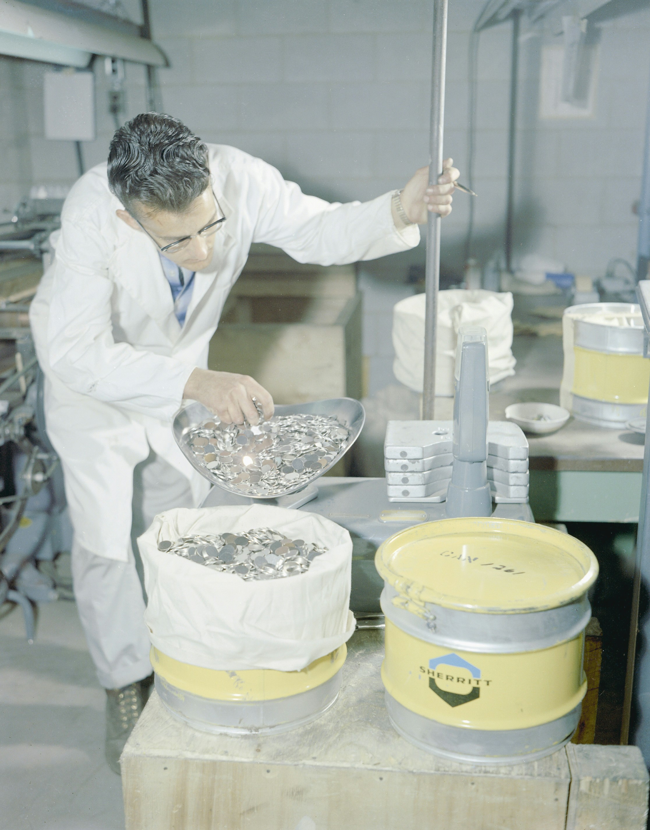 Person holding a sterile container for urine sample collection