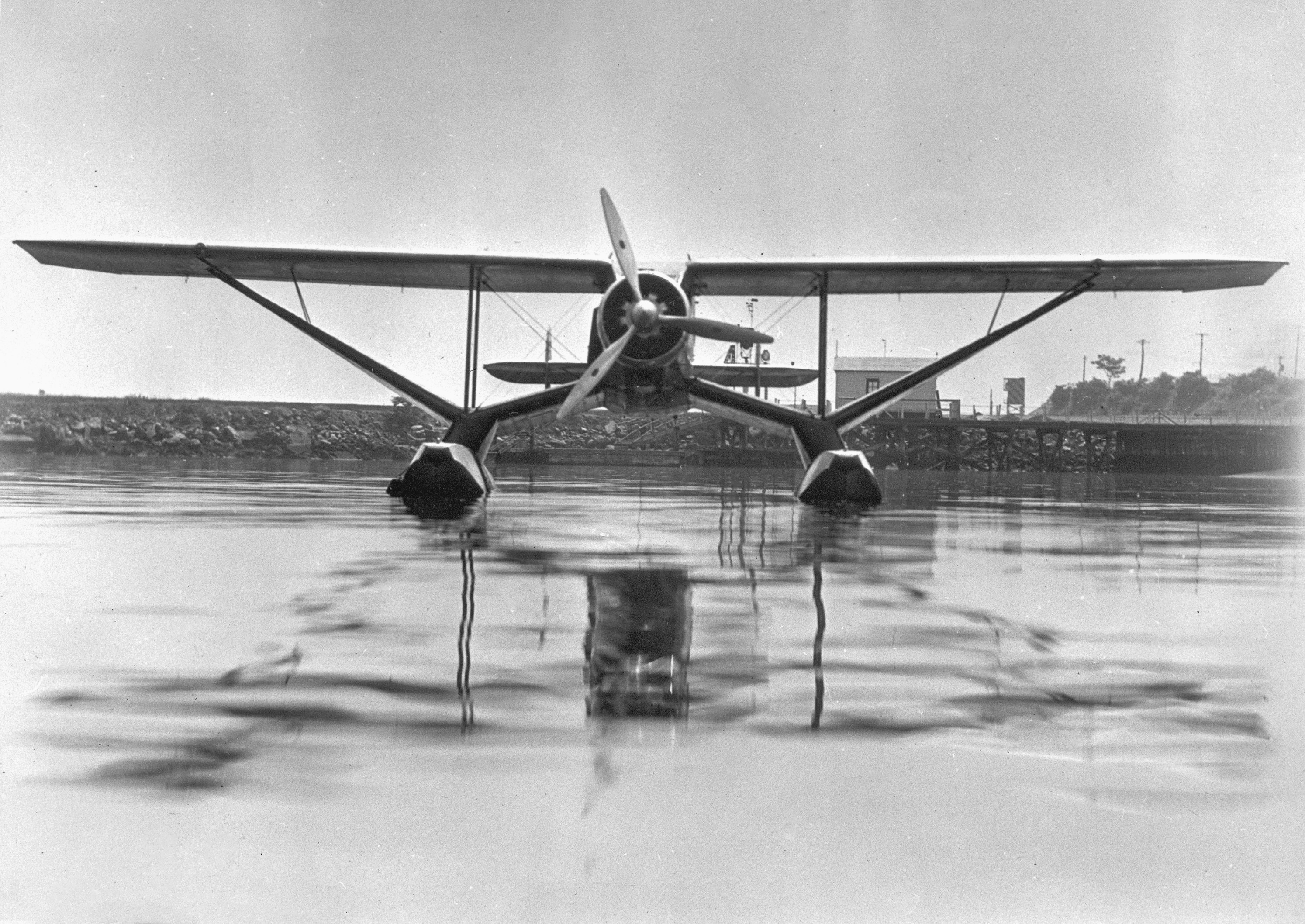 a small plane is sitting on the water, Frontal view of a BKV of the Mackenzie Air Service on Edo floats Provincial Archives of Alberta, A5832. Taken circa 1930