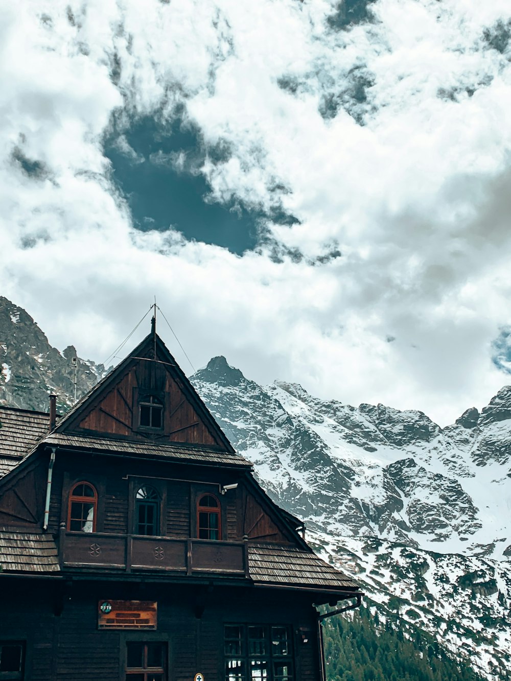 a house with a mountain in the background