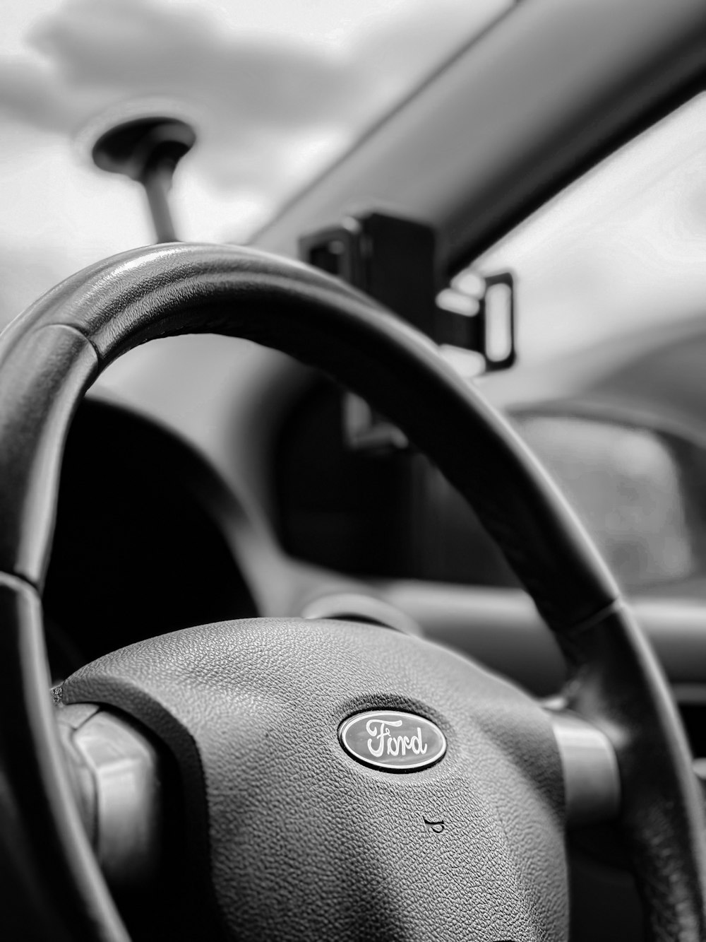 a steering wheel and dashboard of a car