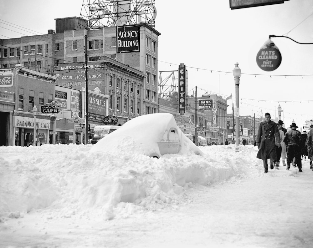 a pile of snow sitting on the side of a road