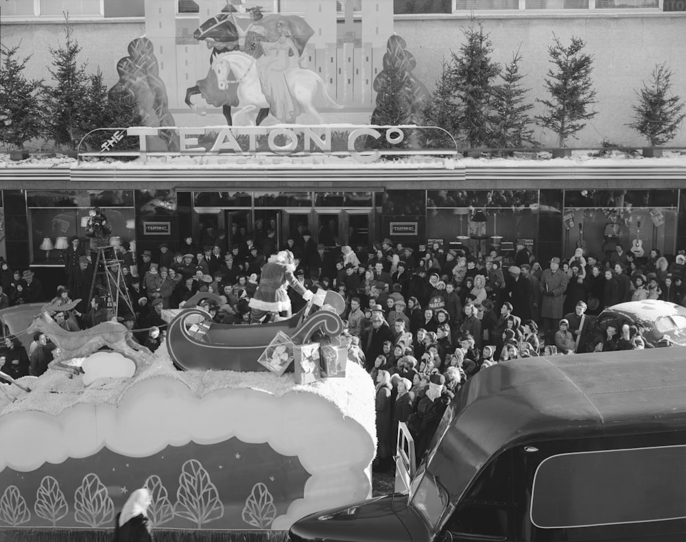a parade float in front of a crowd of people