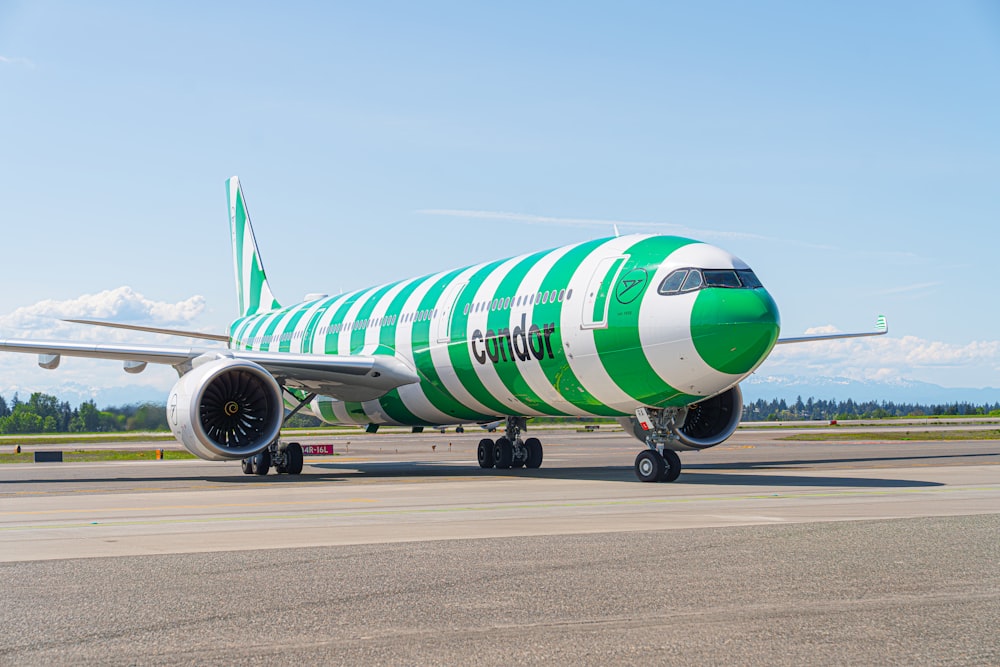 a large jetliner sitting on top of an airport runway