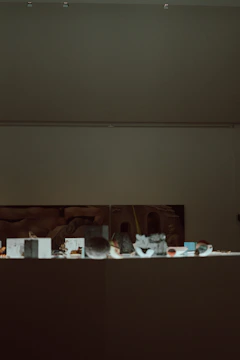 Close-up of ancient artifacts displayed in a softly lit museum.
