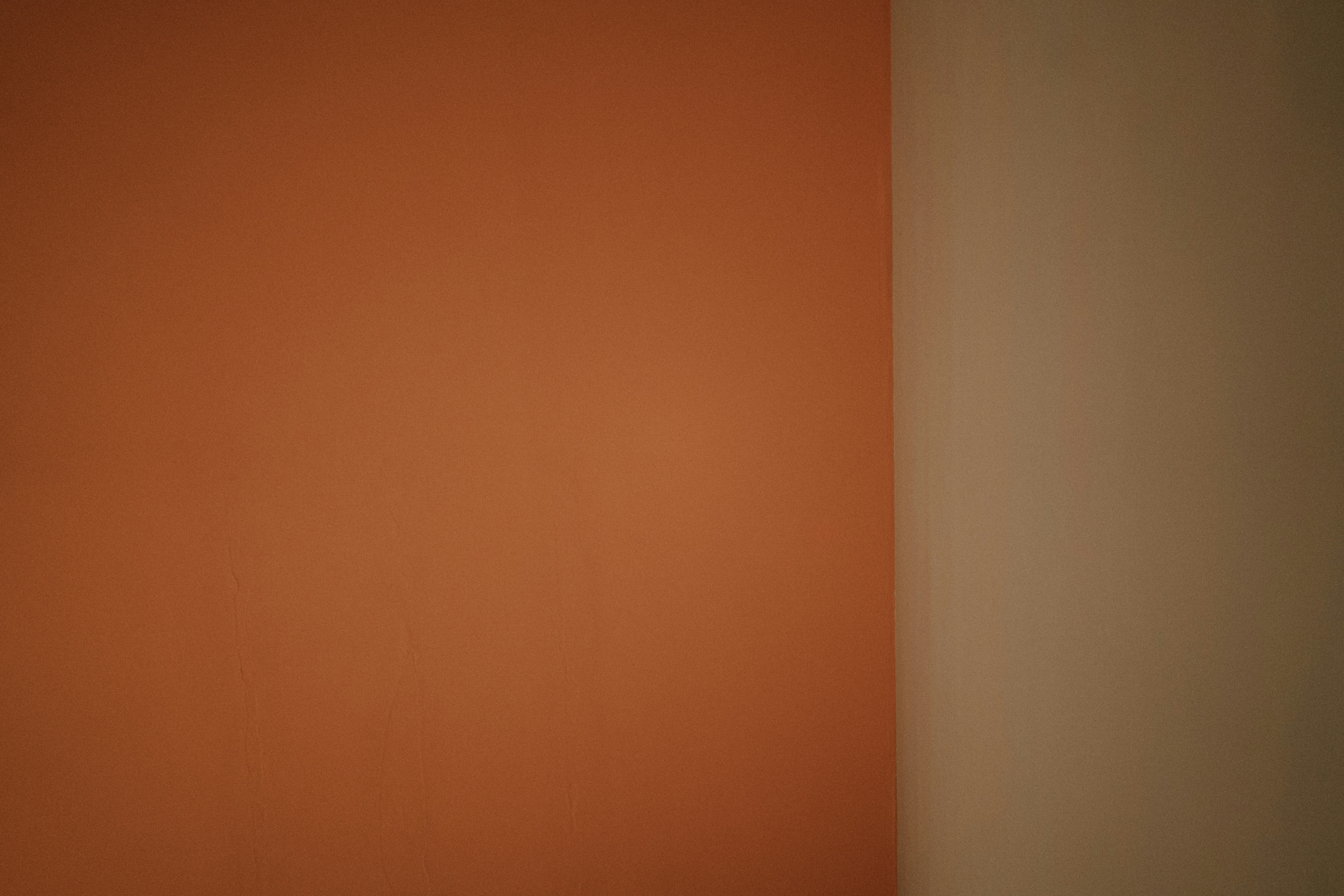 a white toilet sitting in a bathroom next to a wall